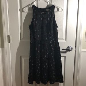 Black sleeveless dress with lipsticks on it